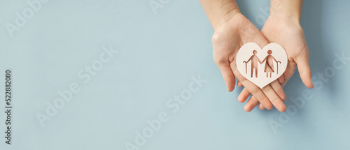 Hands holding elderly couple with walking sticks in heart shape, older people mental health, age care, retirement plan concept