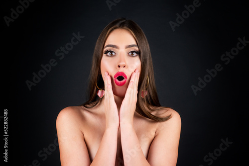 Shocked face of surprised young woman. Funny female shocked face expression. Unbelievable. Portrait of excited woman spreading hands. Expressing surprise open mouth.