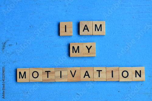 I am my motivation text on wooden square, motivation and health quotes © farzand01