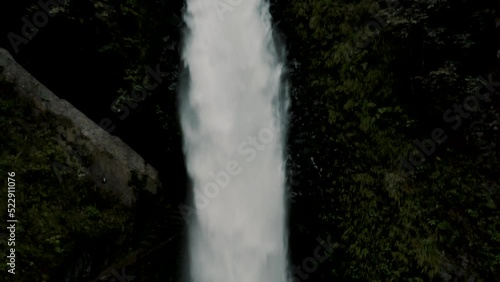 Tourists Visiting The Majestic Pailon del diablo Waterfall In Baños de Agua Santa, Ecuador - drone shot