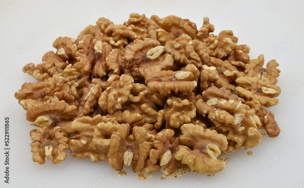 Pile of walnuts isolated on white background. Pile of walnuts isolated on white background.