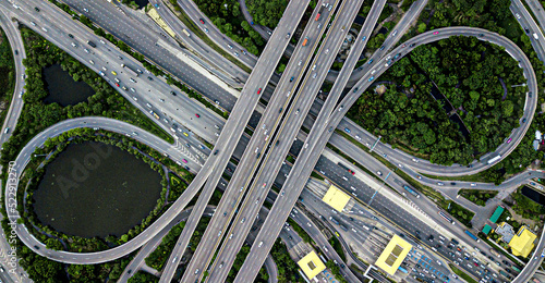 Aerial drone photo of ring road multilevel circular junction road, road junction. Aerial view of the transportation, traffic, route road and expressway in the city in Thailand.