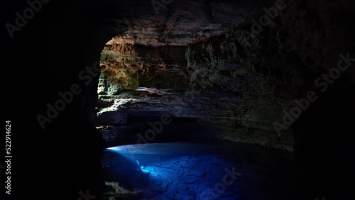 The incredible stunning natural cave pool the Enchanted Well or Poço Encantado in the Chapada Diamantina National Park in Northeastern Brazil with beautiful crystal clear blue water. photo