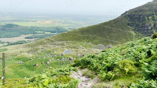 Coumshingaun Lough, Waterford, Ireland. The lake is surrounded by mountains. Travel and hiking concept photo