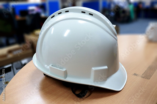 A white safety helmet complete with suspension and chin strap, this head protector is usually used by construction workers to protect their heads while working.