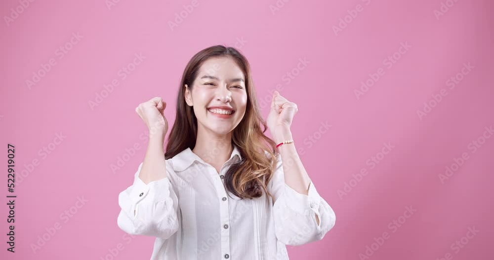 Asian vibrating with happiness for accomplished achievement Asian vibrating with happiness for accomplished achievement