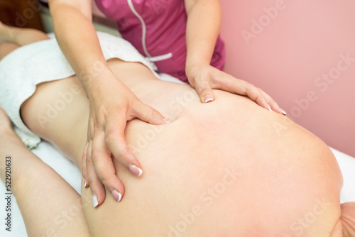 woman relaxing in the spa. The girl enjoys a back massage.