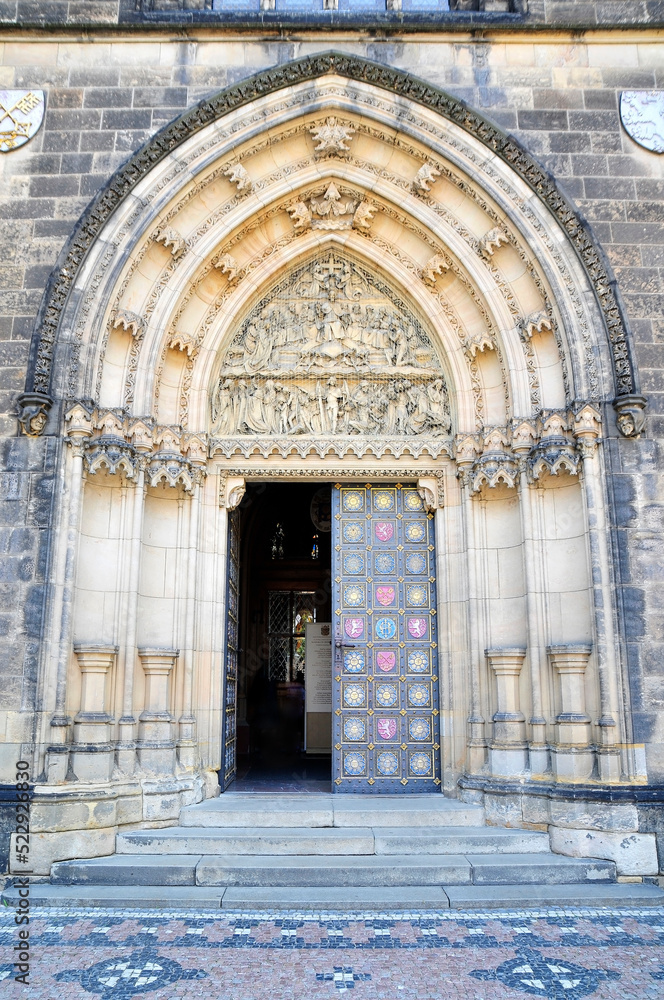 Close-up of the entrance to the Gothic Cathedral of Saints Peter and Paul in Visegrad. door and portal flanked with magnificent moldings, columns and rich carving
