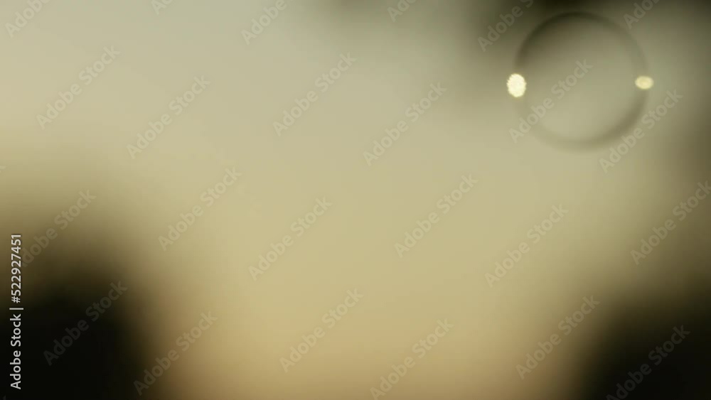 Lots of bubbles float past the screen, in slow motion Lots of bubbles float past the screen, in slow motion