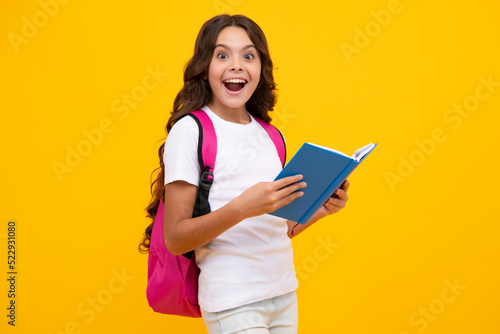 Amazed teen girl. School teenager child girl 12, 13, 14 years old with school bag book and copybook. Teenager schoolgirl student, isolated background. Learning and knowledge. Excited expression
