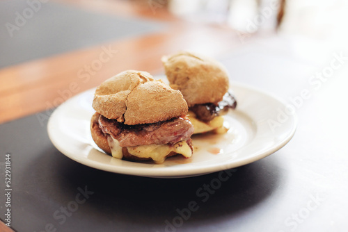 Wallpaper Mural Portuguese meat sandwich called "prego" with a steak and mountain cheese on a plate Torontodigital.ca