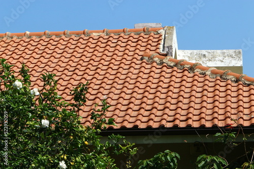 Red tiled roof on a residential building.