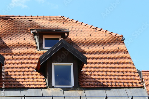 Red tiled roof on a residential building.