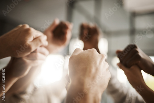 Картината върху платно Diverse people hold hands in teamwork, success and support while showing solidarity, trust and unity in office