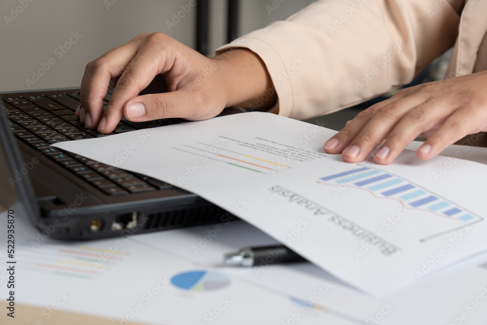 Business woman working for budget or report graph document paper on desk Business woman working for budget or report graph document paper on desk