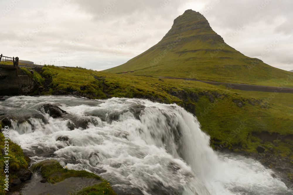 View at mount and waterfall of Kirkjufell at Grundarfjordur in Iceland View at mount and waterfall of Kirkjufell at Grundarfjordur in Iceland