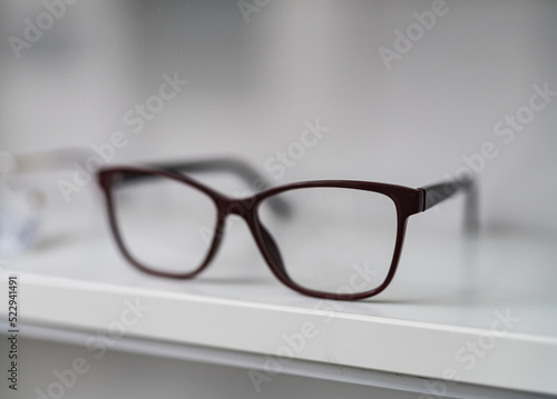 Close up view of modern eyeglasses. Eyewear accessory on white background.