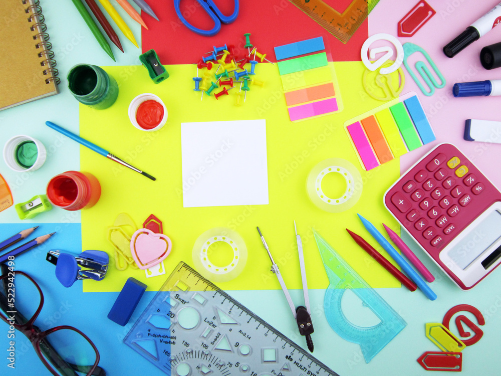        school supplies on abstract colorful background texture                  