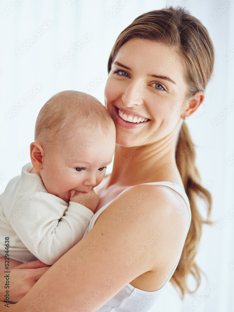 Mother bonding with baby boy, smiling and enjoying family time in a room at home. Portrait of a happy, loving and caring single parent holding or carrying an adorable, cute and little newborn child Mother bonding with baby boy, smiling and enjoying family time in a room at home. Portrait of a happy, loving and caring single parent holding or carrying an adorable, cute and little newborn child