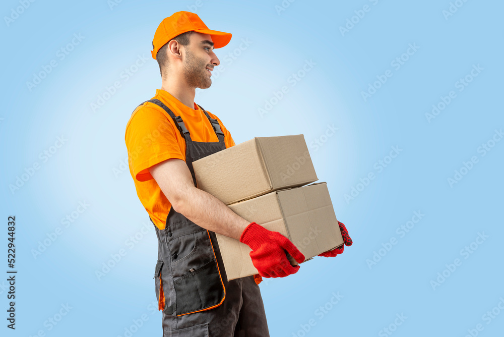 Delivery man with box. Staff laborer, orange uniform cap, tshirt