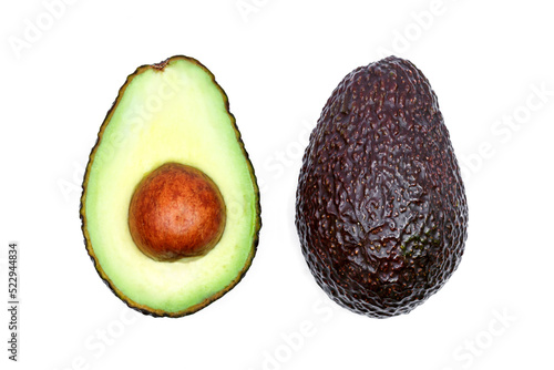 ripe hass avocado half with seed isolated on white background photo