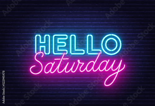 Hello Saturday sign on brick wall background.