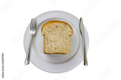  Top view of breakfast scene with home wheat bread on white plate with a knife and a fork , Morning breakfast concept.  fast food.