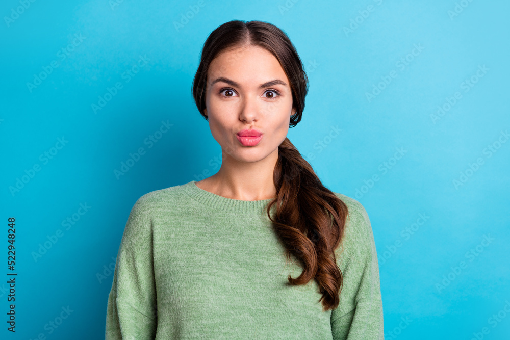 Fototapeta premium Photo of pretty coquettish lady pouted lips kiss wear pullover isolated on blue color background
