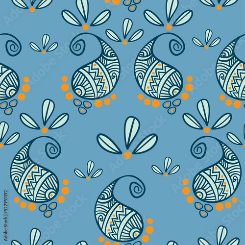 decorative blue and yellow color paisley pattern is an ornamental seamless design illustration . photo