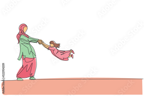 Single continuous line drawing of young Arabian mother playing and swinging her daughter fly. Islamic muslim happy family parenthood concept. Trendy one line graphic draw design vector illustration