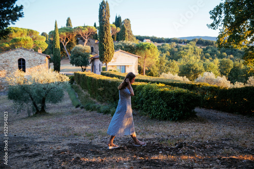 Beautiful landscape with house in Tuscany, Italy. Traditional country house, old farmhouse in Tuscany. Rural house in summer. Solo woman traveler. Solo woman travel in Tuscany, summer in Italy. 