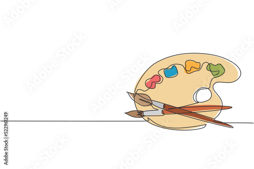 Single continuous line drawing of paintbrushes with color palette with acrylic paint. Back to school minimalist style. Art education concept. Modern one line draw graphic design vector illustration