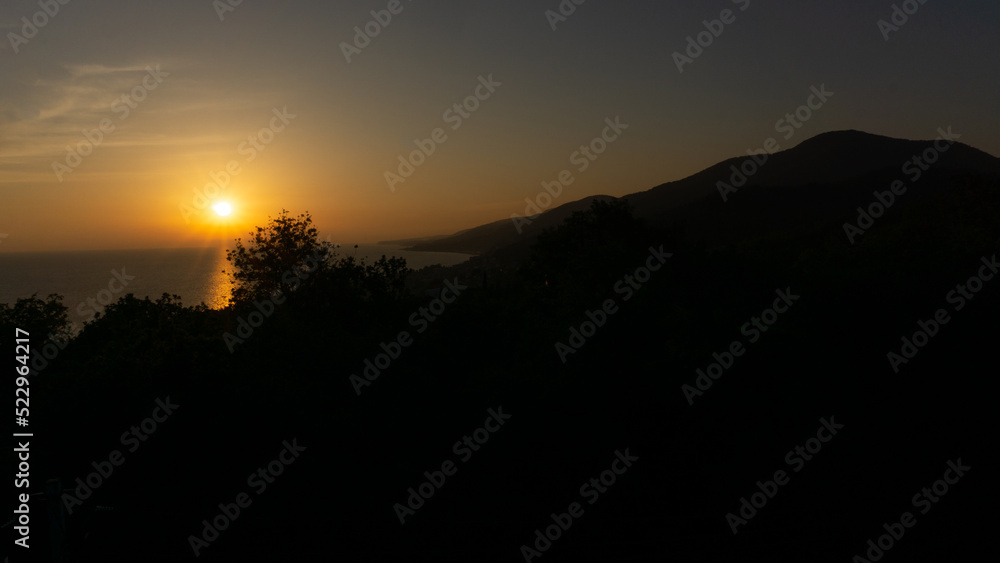 Panorama of sunset in the mountains. A magical view of the sea from the observation deck. Lazarevskoe, Sochi, Russia.