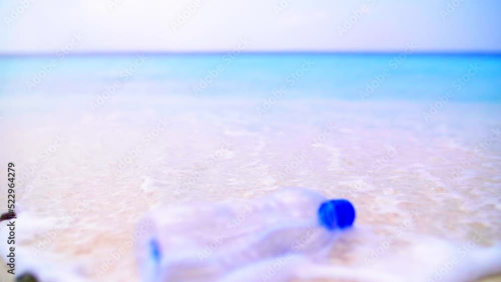 Slow Motion Lockdown Shot Of Plastic Bottle Floating On Seashore At Beach - Great Barrier Reef, Australia Slow Motion Lockdown Shot Of Plastic Bottle Floating On Seashore At Beach - Great Barrier Reef, Australia