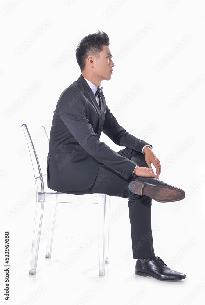 Handsome fashion model.
elegant man wear formal black suit with bow tie sitting chair on white background
Handsome fashion model.
elegant man wear formal black suit with bow tie sitting chair on white background