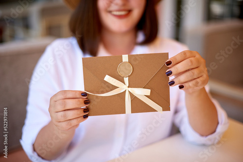 Wallpaper Mural woman hold sealed envelopes. invitation envelope with ribbon and wax seal, gift certificate, wedding invitation card Torontodigital.ca