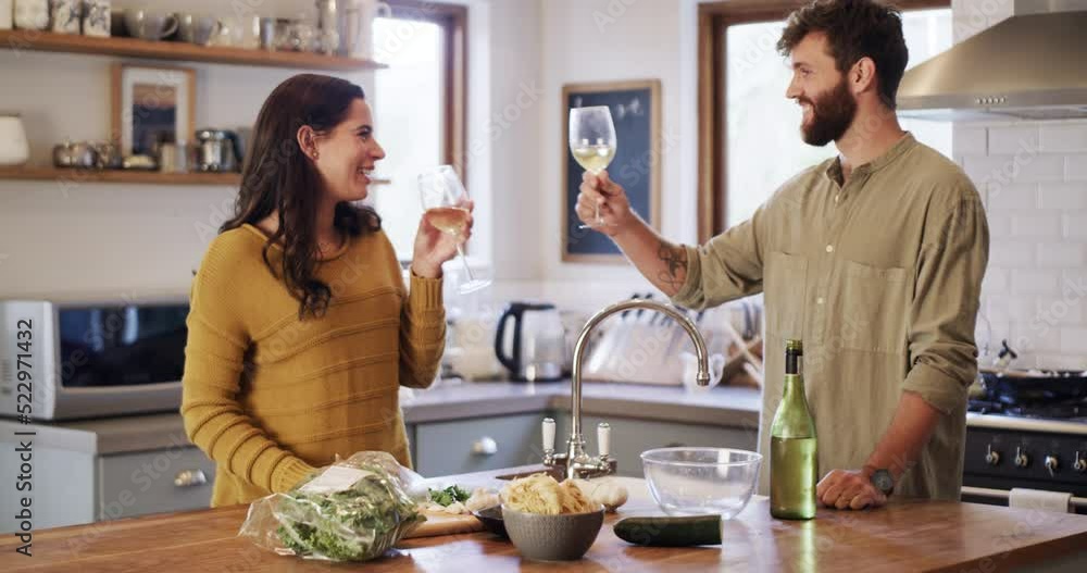 Young couple cooking, drinking wine and preparing a meal together while bonding, having fun and talking in home kitchen. Smiling, happy and caring husband and wife making healthy food for date night Young couple cooking, drinking wine and preparing a meal together while bonding, having fun and talking in home kitchen. Smiling, happy and caring husband and wife making healthy food for date night