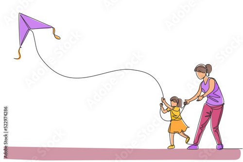 One continuous line drawing of young mother and her daughter playing to fly kite up into the sky at outdoor field. Happy family parenthood concept. Dynamic single line draw design vector illustration