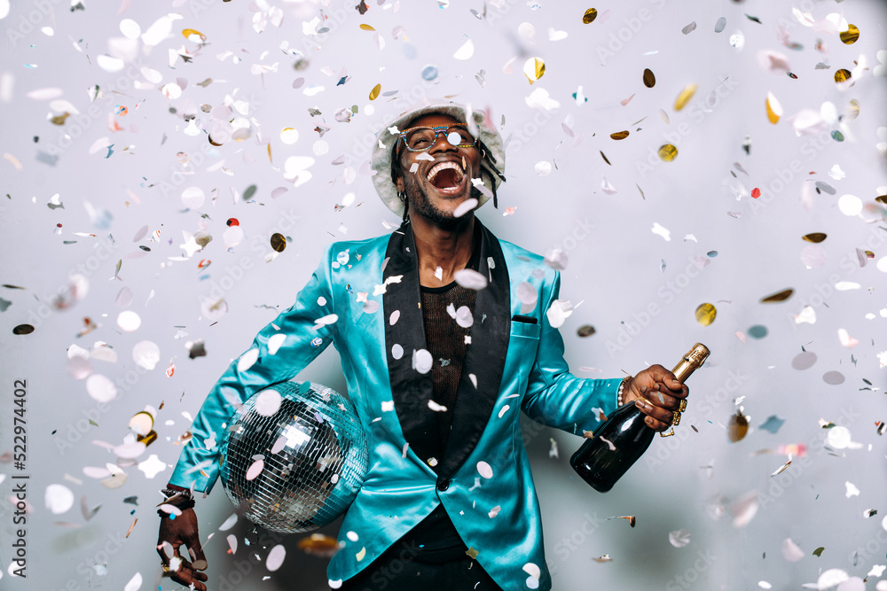artistic portrait with gel lights. Handsome man posing on colored backgrounds. Artist singer performer posing for the album cover artistic portrait with gel lights. Handsome man posing on colored backgrounds. Artist singer performer posing for the album cover