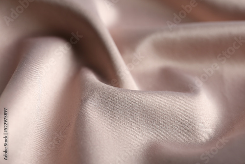 Texture of delicate pink fabric as background, closeup