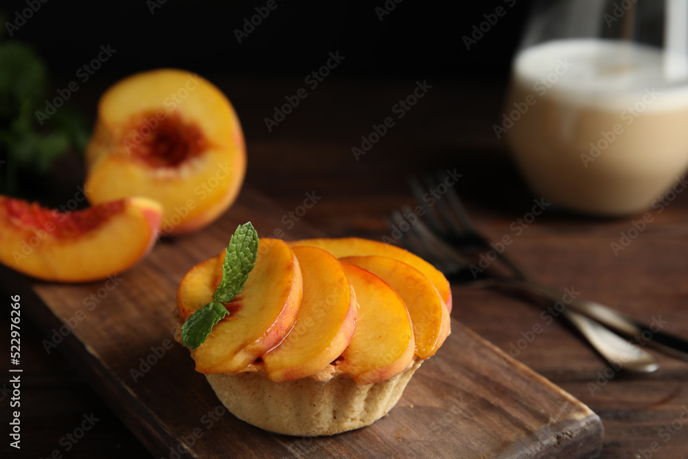 Delicious peach dessert on wooden table, closeup - obrazy, fototapety, plakaty 
