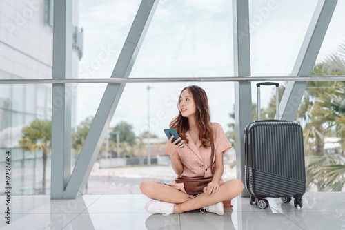 Asian woman teenager using smartphone at airport terminal sitting with luggage suitcase and backpack for travel in vacation summer relaxing waiting flight transport or booking ticket Free Download Asian woman teenager using smartphone at airport terminal sitting with luggage suitcase and backpack for travel in vacation summer relaxing waiting flight transport or booking ticket - GFXLoad