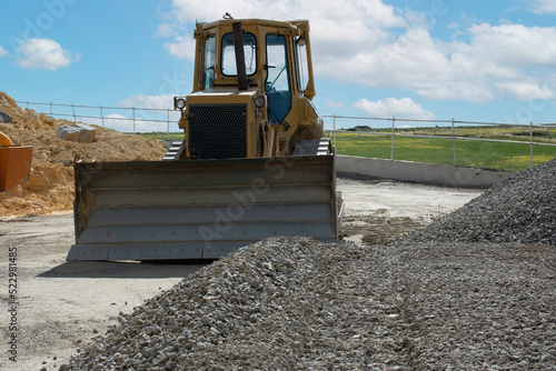 Excavator building a road in a site construction