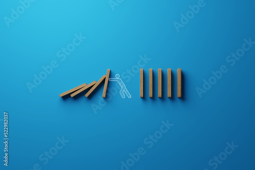 The man stops falling dominoes. The concept of showing strength in business. 3d render photo