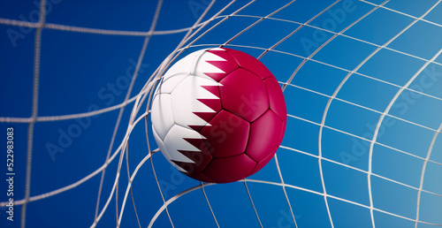 Soccer ball with flag of Qatar hitting the net of goal - 3d illustration
