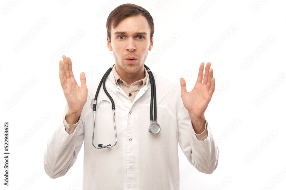 Portrait of angry doctor in white medical coat with stethoscope upset face screaming on white background with copy space Portrait of angry doctor in white medical coat with stethoscope upset face screaming on white background with copy space