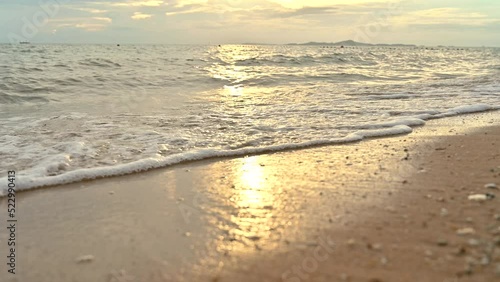 Wallpaper Mural Close up soft wave water on sandy beach seaside during sunset. summer vacation activity background concept Torontodigital.ca