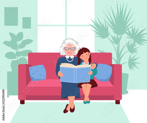 Elderly woman and a little girl are sitting on the sofa and looking at a book. Grandmother reads to her granddaughter. Window and silhouettes of potted flowers in the background. Vector illustration