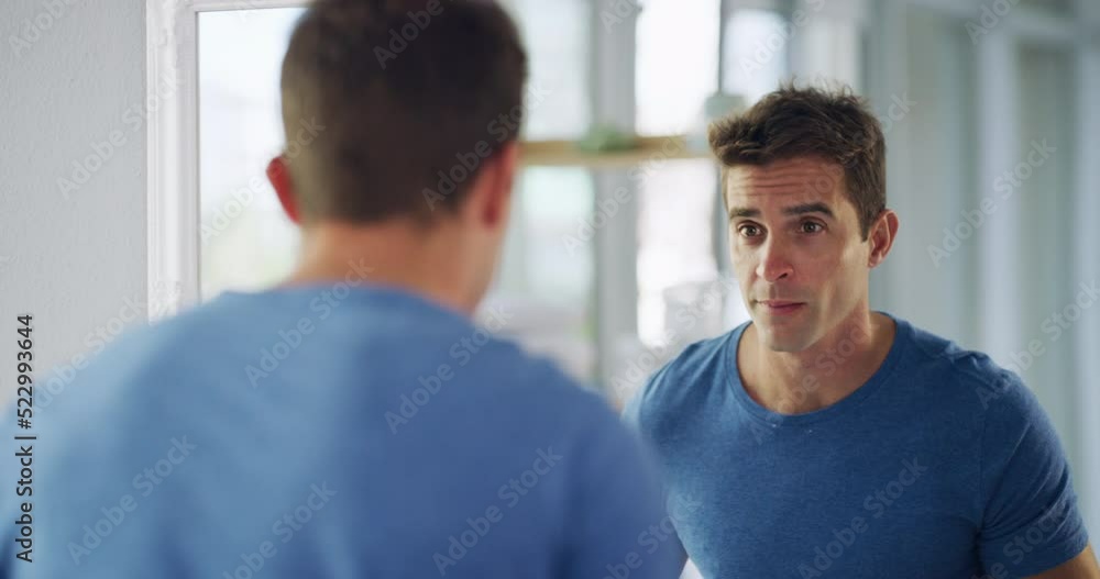 Beauty, grooming and shaving with a handsome man looking at his reflection in the mirror at home and feeling confident, sexy and charming. Male getting ready for the day in the bathroom and smiling Beauty, grooming and shaving with a handsome man looking at his reflection in the mirror at home and feeling confident, sexy and charming. Male getting ready for the day in the bathroom and smiling