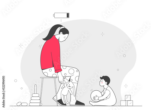 Tired young mother is sitting on stool  she has no strength and energy  a small child and children s toys are nearby. The concept of emotional burnout of mothers.